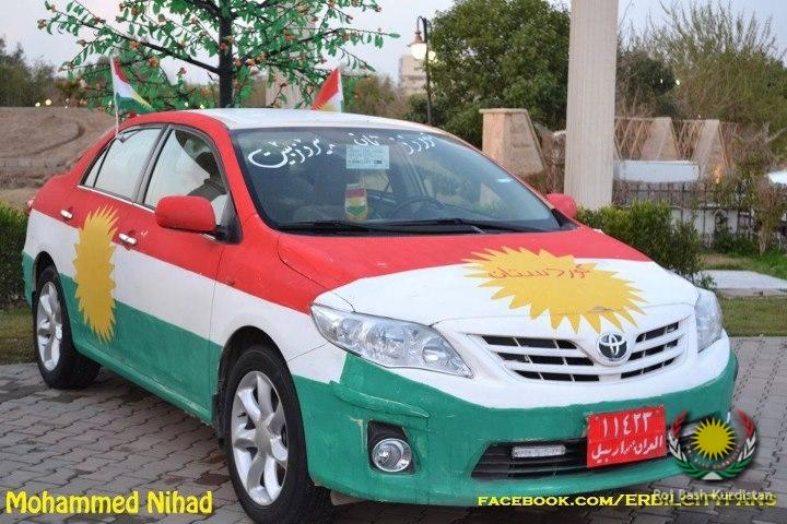 Kurdistan flag painted on a car